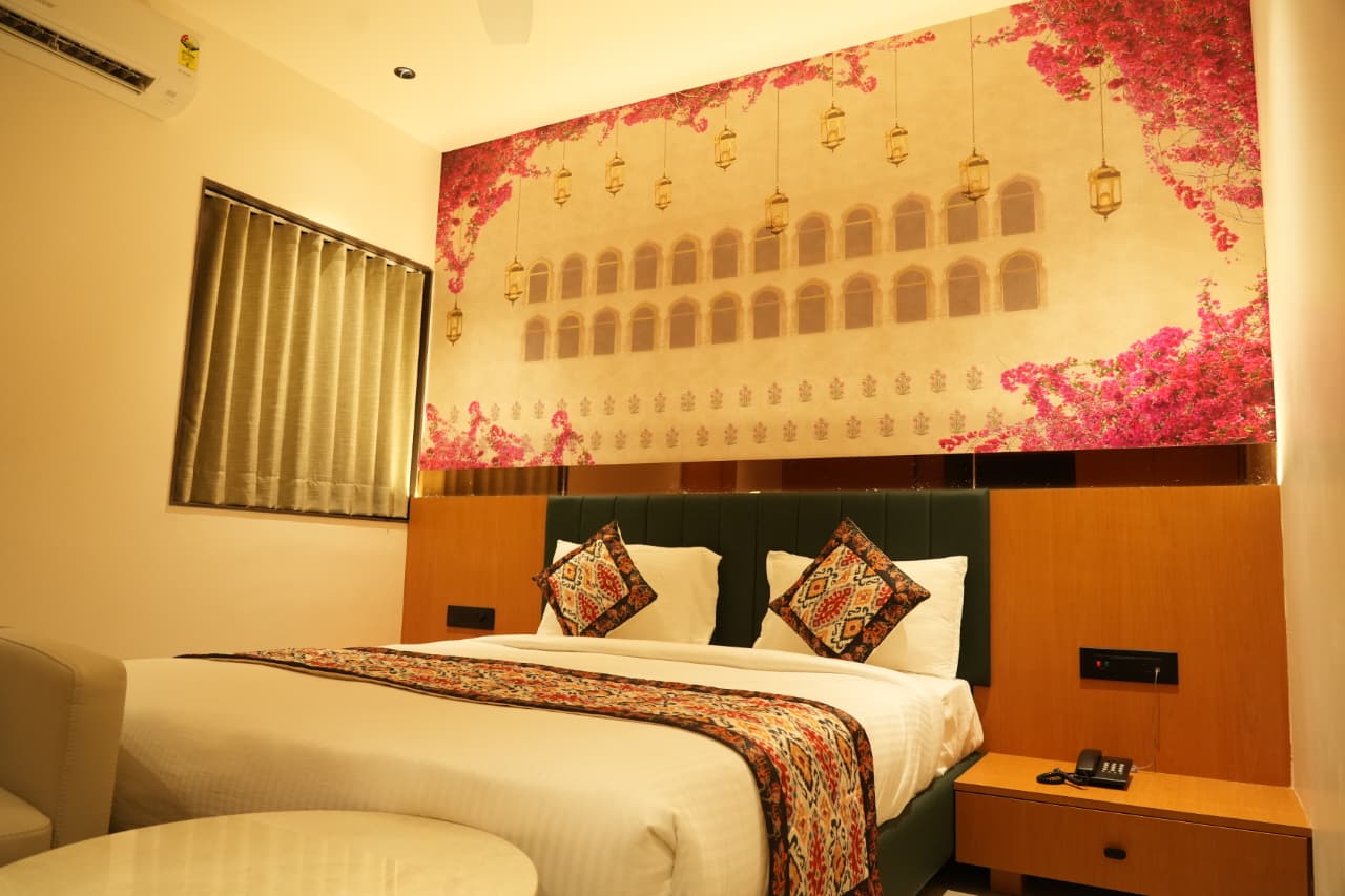 Elegant room styling and amenities at Hotel The Grand Om Krishna, Dwarka