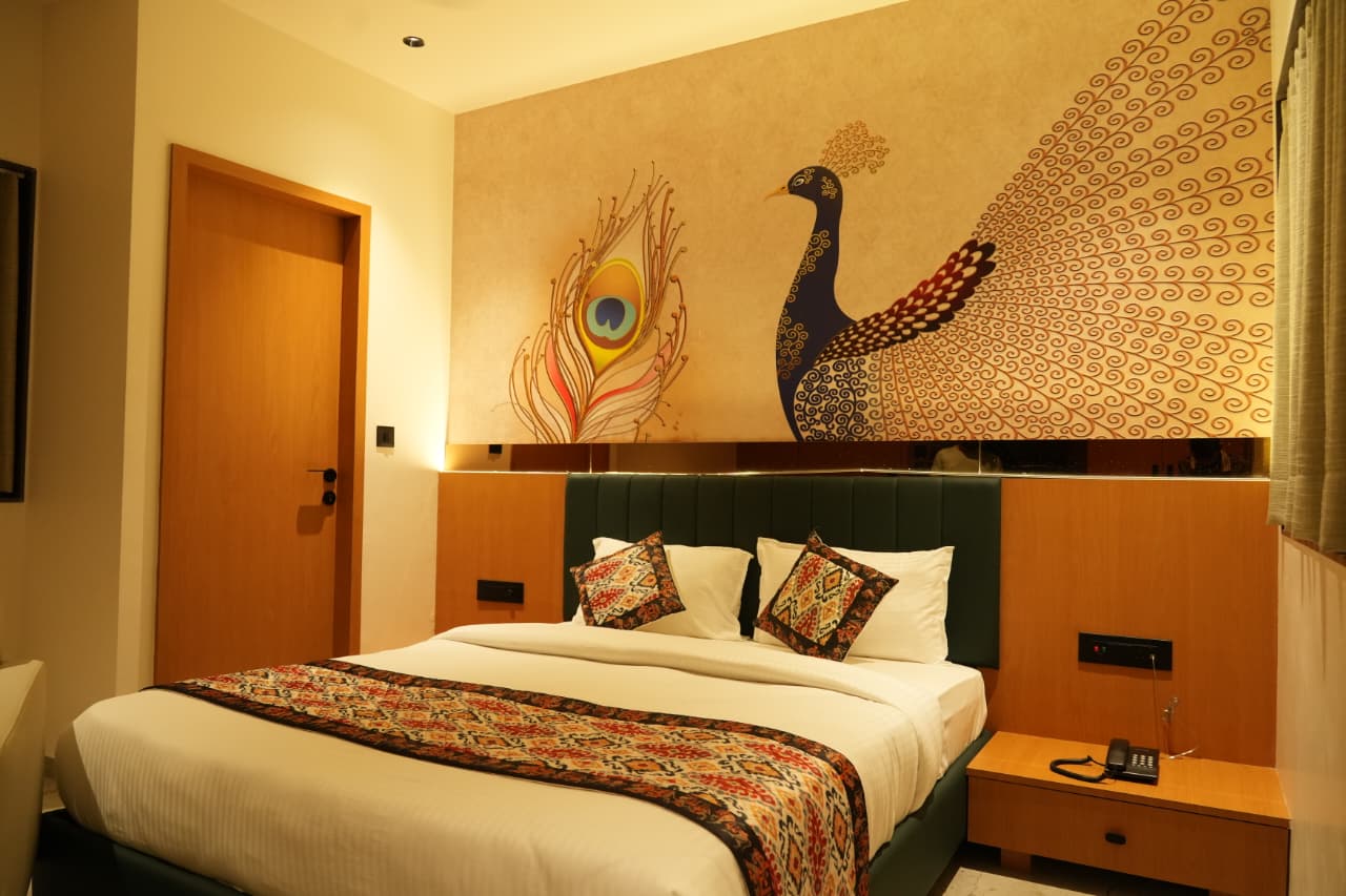 Luxurious room with heritage-inspired decor at Hotel The Grand Om Krishna